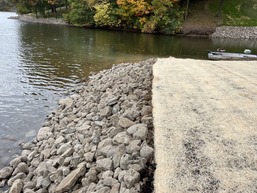 stone-retaining-wall-jetty-into-pond