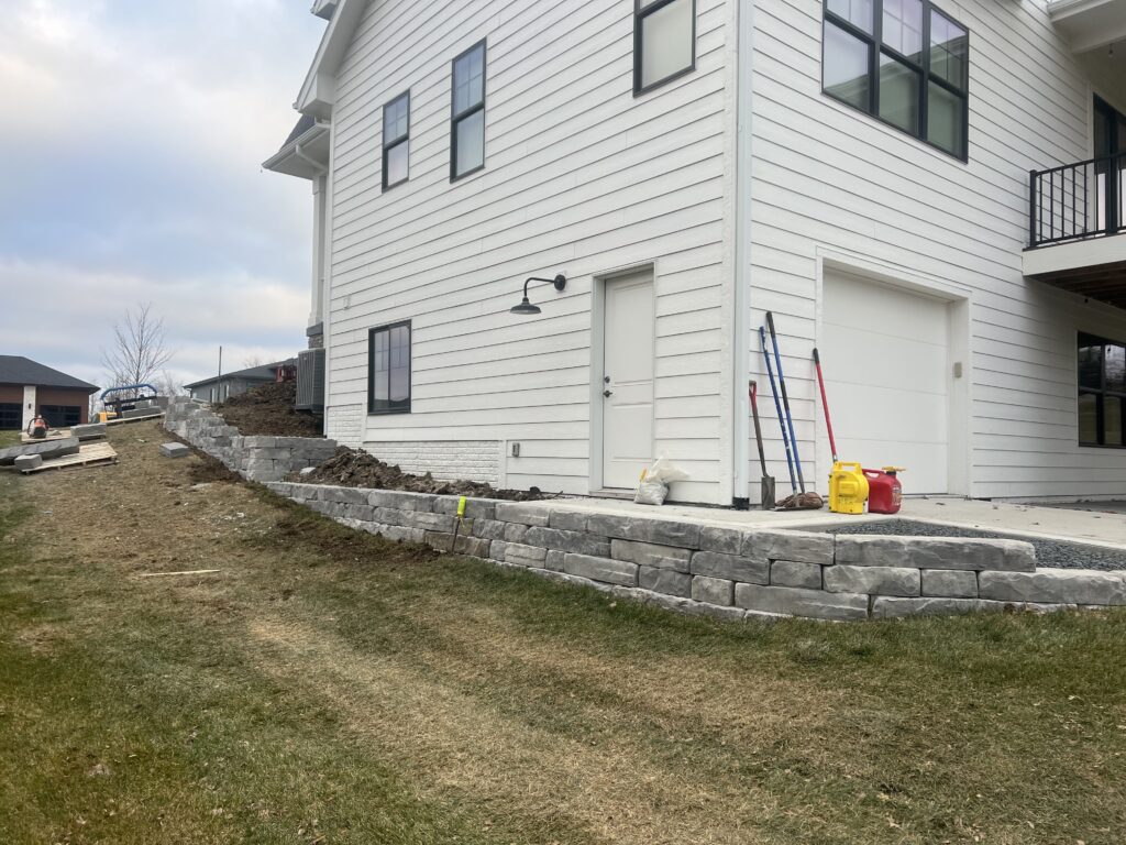 stone-wall-around-house-to-backyard