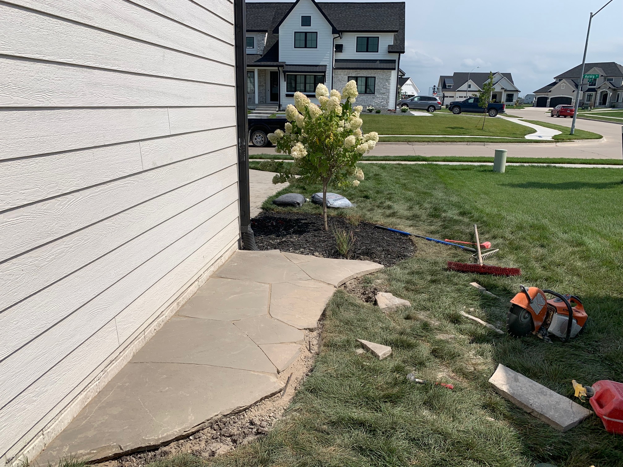 side-of-house-flower-beds-with-stone